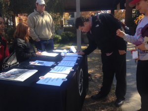 A UGA student signs a pledge to take a stand against sexual assault.