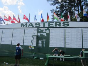 Setting up the Masters score board. Photo credit Zack Watson.