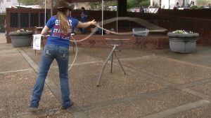 UGA Brock and Bridle Club demonstrating cattle roping in Tate Plaza