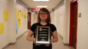 Savannah Van Buren holding Award 