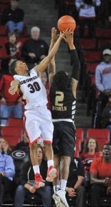 Georgia guard J.J. Frazier (30) saves the ball from going out of bounds during the Bulldog's game with the Oakland Grizzlies at the Stegeman Coliseum on Tuesday, December 1st, 2015 in Athens, Ga. (Photo by Sean Taylor)