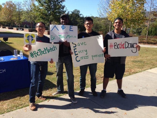 Lambda Epsilon Psi members promote the SEC "swab-off" outside of the UGA Tate Student Center.