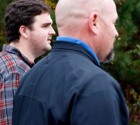 Justin Strength, campaign manager for State House candidate, Marcus Wiedower, walks alongside Wiedower while campaigning in Watkinsville, Georgia on Friday, November 2, 2018. Strength works for War Room Strategies, the company running Weidower’s campaign, as the social media director and became campaign manager for Wiedower through that job. (Emily Graven, emilyrgraven@gmail.com)