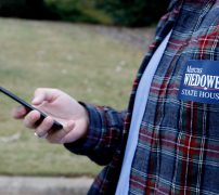Justin Strength stares at his phone while directing his way through a neighborhood to campaign for Marcus Wiedower on Friday, November 2, 2018, in Watkinsville, Georgia. Strength is a graduate of the University of Georgia and works for War Room Strategies as the social media director as well as campaign manager for Wiedower. (Emily Graven, emilyrgraven@gmail.com)