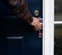 Justin Strength, campaign manager for Marcus Wiedower, leaves a flyer at a door on Friday, November 2, 2018, in Watkinsville, Georgia. Strength is organizing the GOTV initiative as Wiedower is running against Jonathan Wallace in the District 119 State House race. (Emily Graven, emilyrgraven@gmail.com)