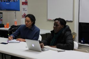 Nnenne Onyioha-Clayton, Athens for Everyone event coordinator, and Rachelle Berry, a University of Georgia doctoral student and prison reform activist, discuss opposition to unpaid prison labor in Athens-Clarke County. (Photo/Raphaëla Alemán)
