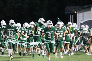 Athens Academy's football team enters the field against Towns County.