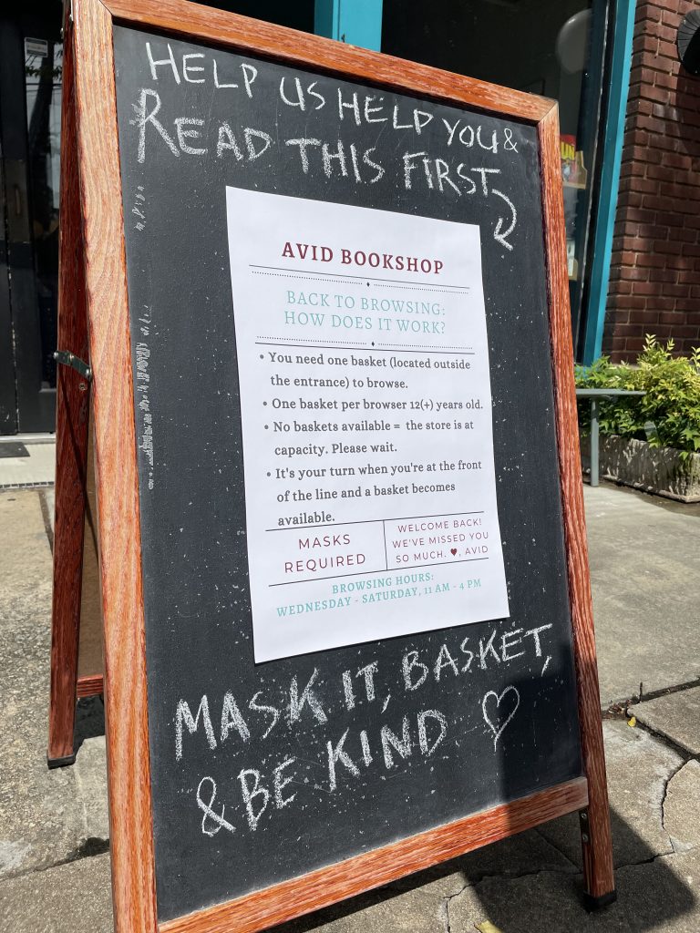 Chalkboard sign in front of Avid Bookshop