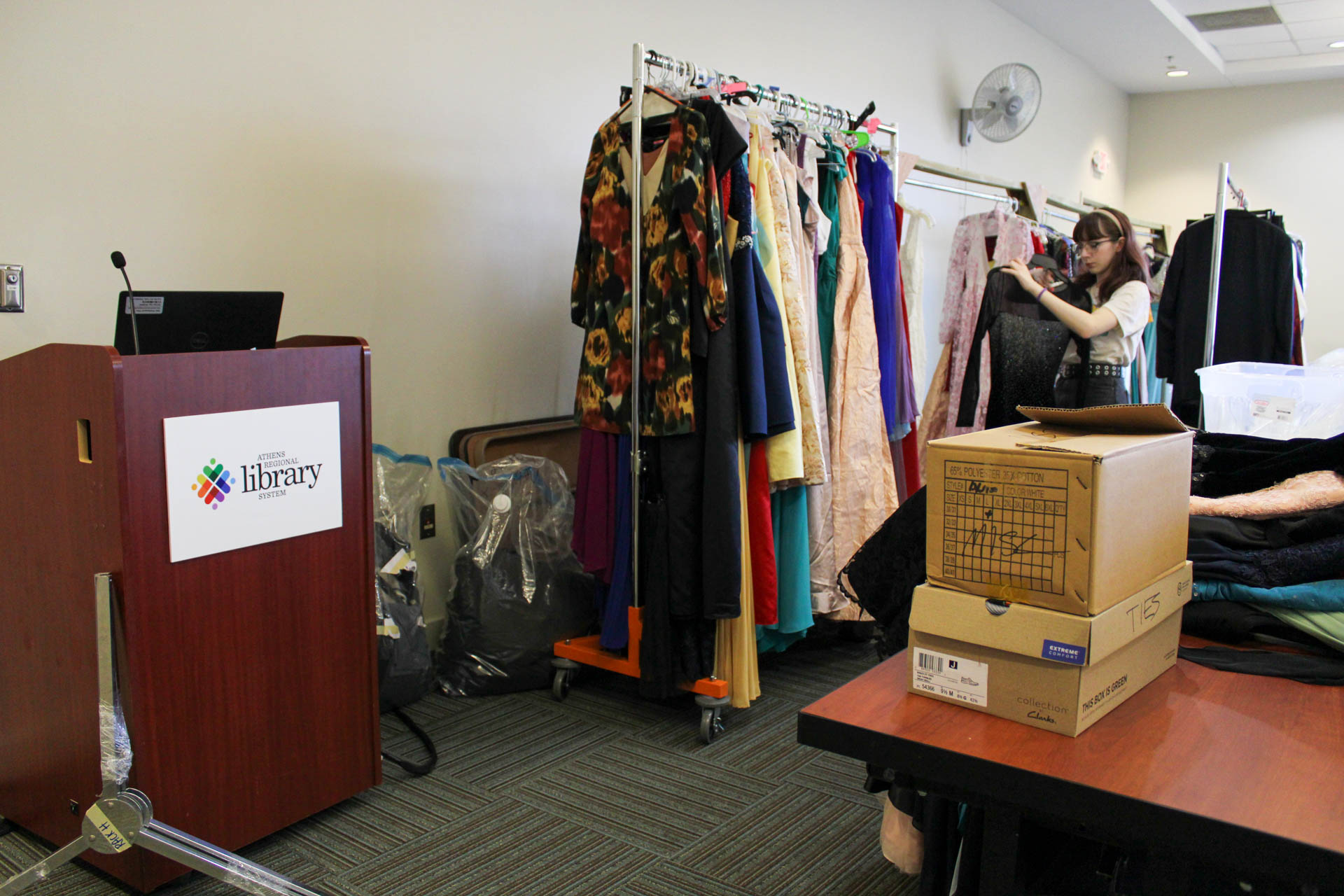 Jess Patrick helps organize clothing for the ACC Library's Bling Your Prom Event