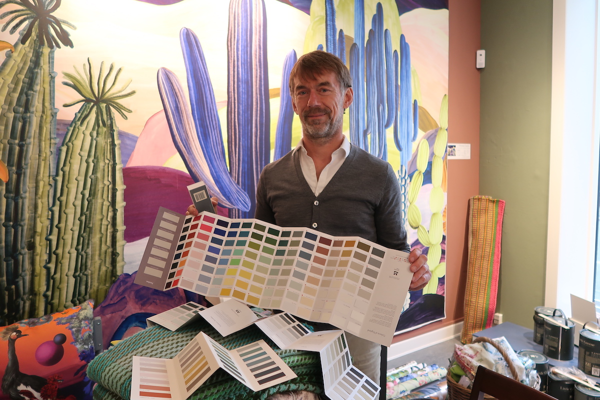Niels Rejnhold holds up paints from one of his favorite brands, Little Greene. (Morgan Quinn / Photo) 