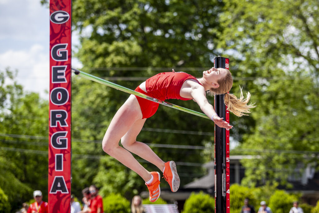 A University of Georgia high jumper sails over the bar at a meet in Athens.