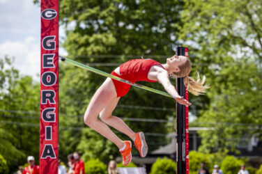 A University of Georgia high jumper sails over the bar at a meet in Athens.