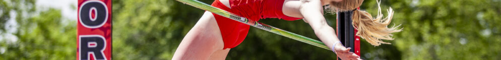 A University of Georgia high jumper sails over the bar at a meet in Athens.