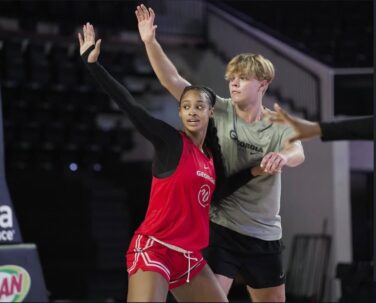 A UGA women's basketball player competes against a male practice-squad player