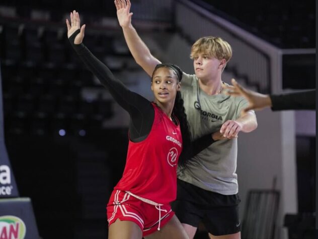 A UGA women's basketball player competes against a male practice-squad player