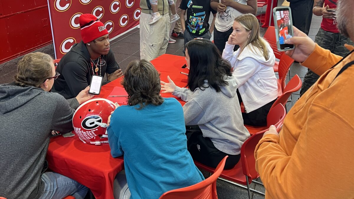 Clarke Central football player Hezekiah Millender talks to the media after committing to attend the University of Georgia on a football scholarship. Courtesy Clarke Central High School