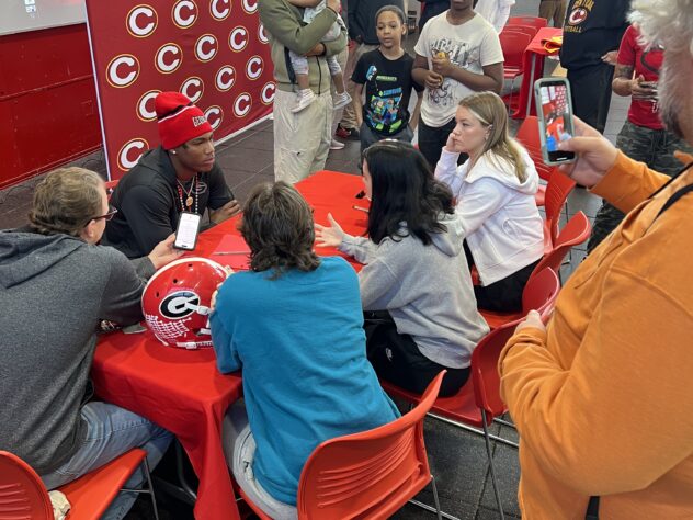 Clarke Central football player Hezekiah Millender talks to the media after committing to attend the University of Georgia on a football scholarship. Courtesy Clarke Central High School