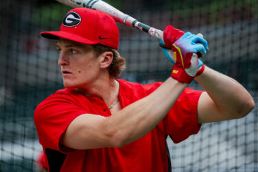 A baseball player taking batting practice