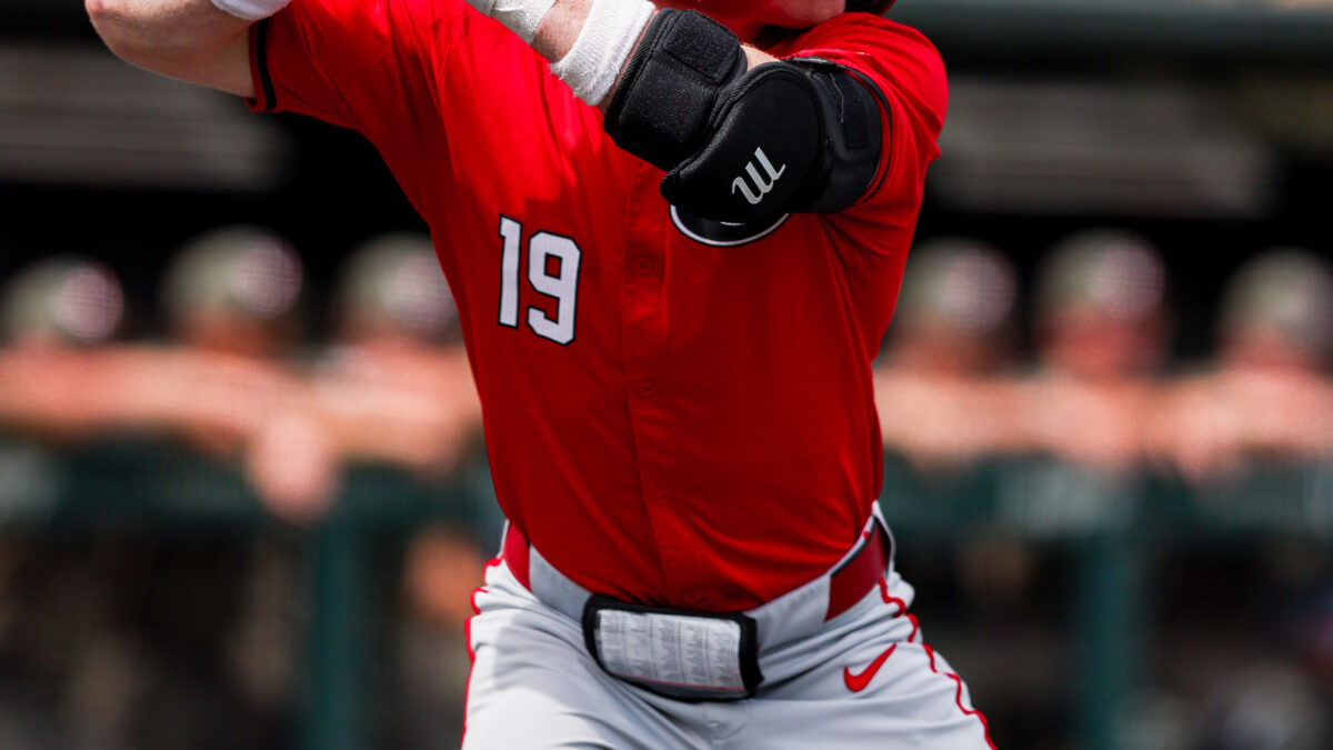 A baseball batter prepares to take a pitch.