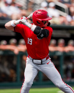 A baseball batter prepares to take a pitch.