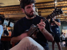 Man plays mandolin at a bluegrass event