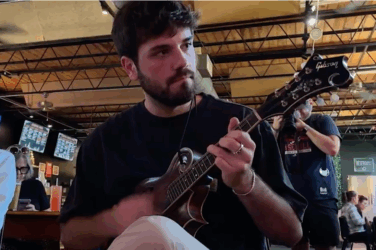 Man plays mandolin at a bluegrass event