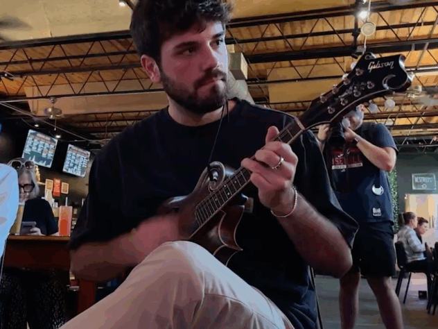 Man plays mandolin at a bluegrass event