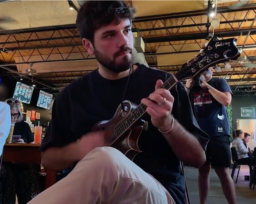 Man plays mandolin at a bluegrass event