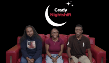 Three hosts sitting on a red couch with the Grady Nightshift logo behind them