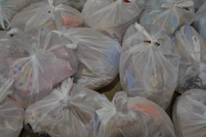 A pile of bags of donations for people