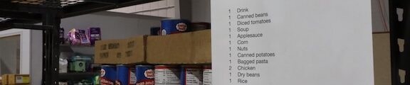 Boxes of food on a shelf next to a list of items