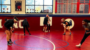 The Jefferson High School girls wrestling team practices with coach Nick White.