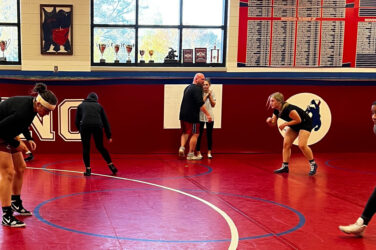 The Jefferson High School girls wrestling team practices with coach Nick White.