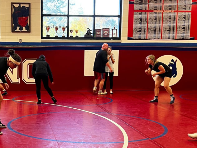 The Jefferson High School girls wrestling team practices with coach Nick White.