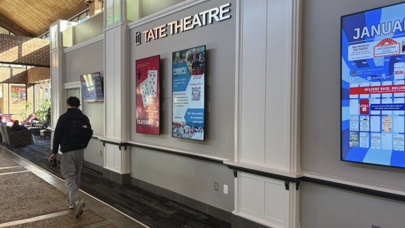A student walks inside of a building 