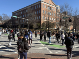 A large amount of students use crosswalks during a passing time in the class schedule.