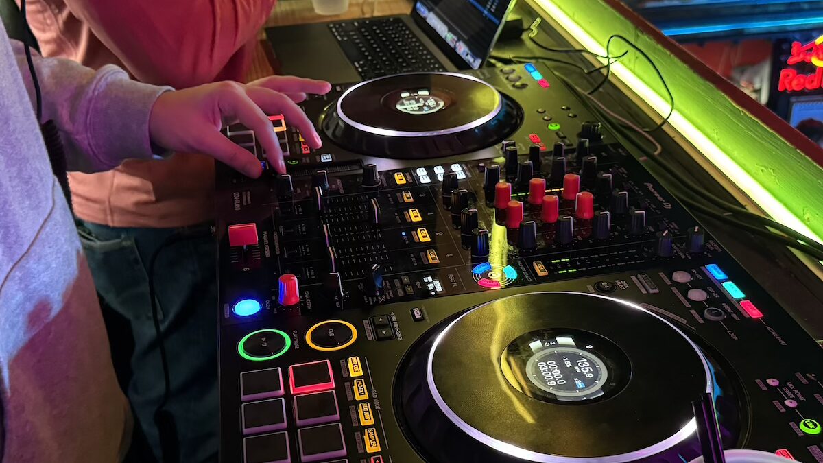 A turntable with two people standing nearby