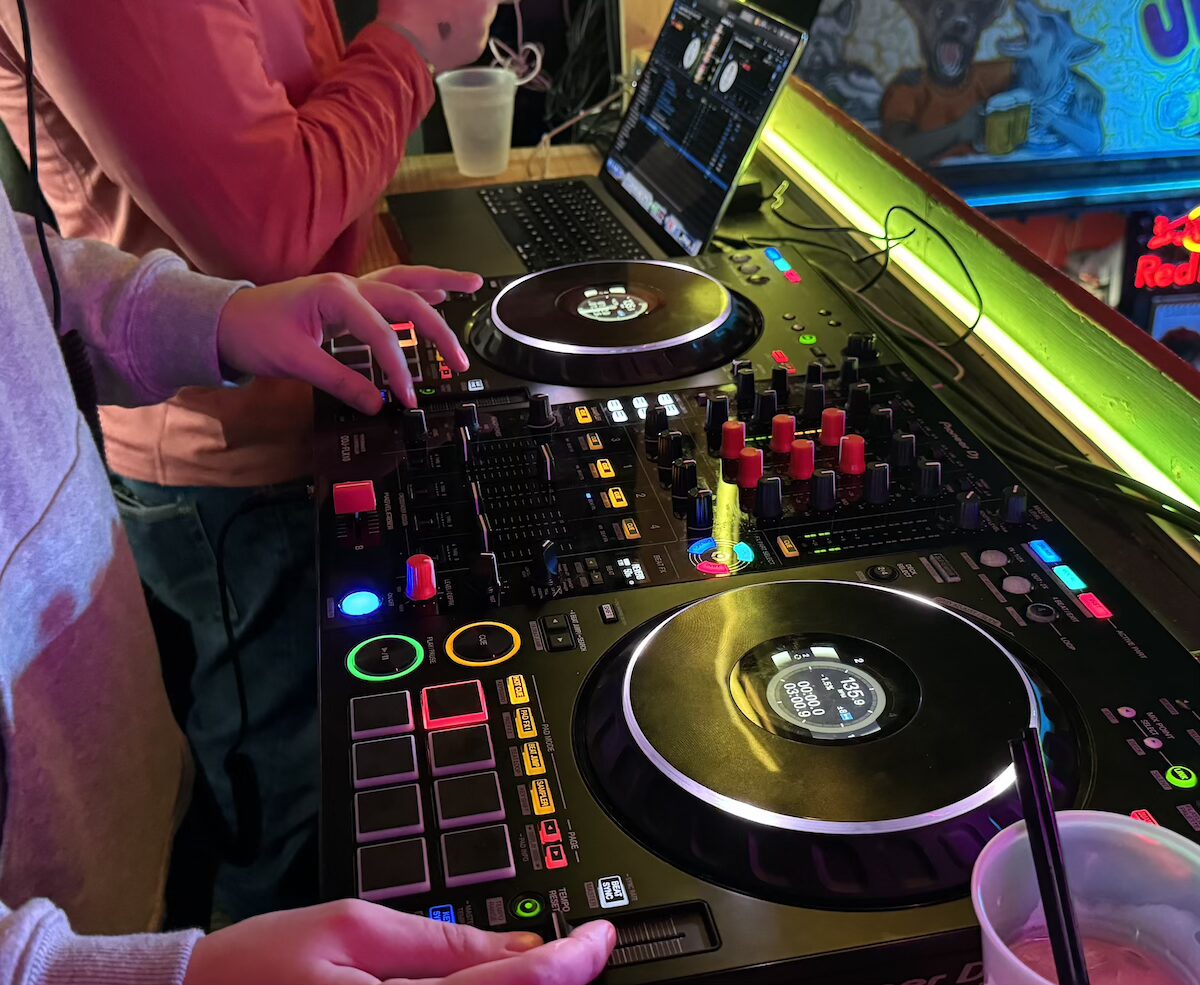 A turntable with two people standing nearby