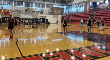 Girls basketball team practices on the court