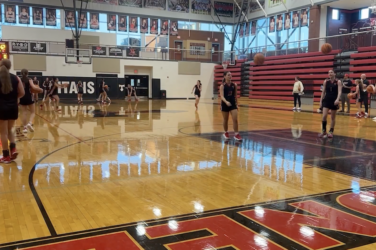 Girls basketball team practices on the court