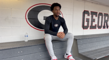 UGA baseball player sits in the dugout to be interviewed