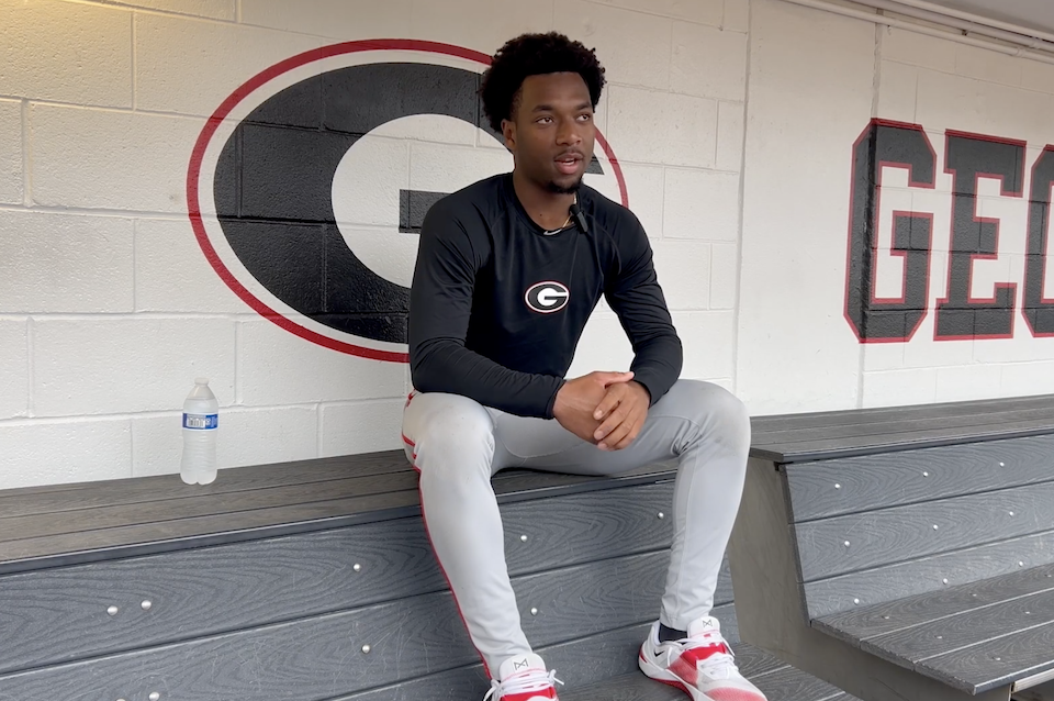 UGA baseball player sits in the dugout to be interviewed