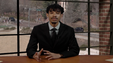 Sports anchor sitting at a desk