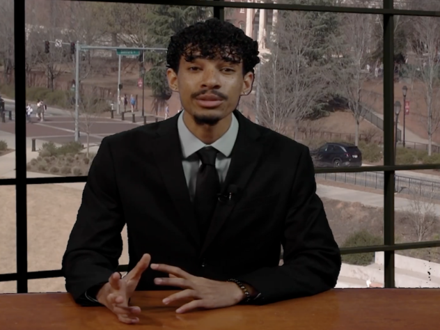 Sports anchor sitting at a desk