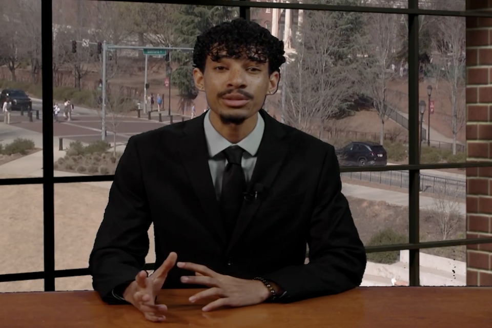 Sports anchor sitting at a desk