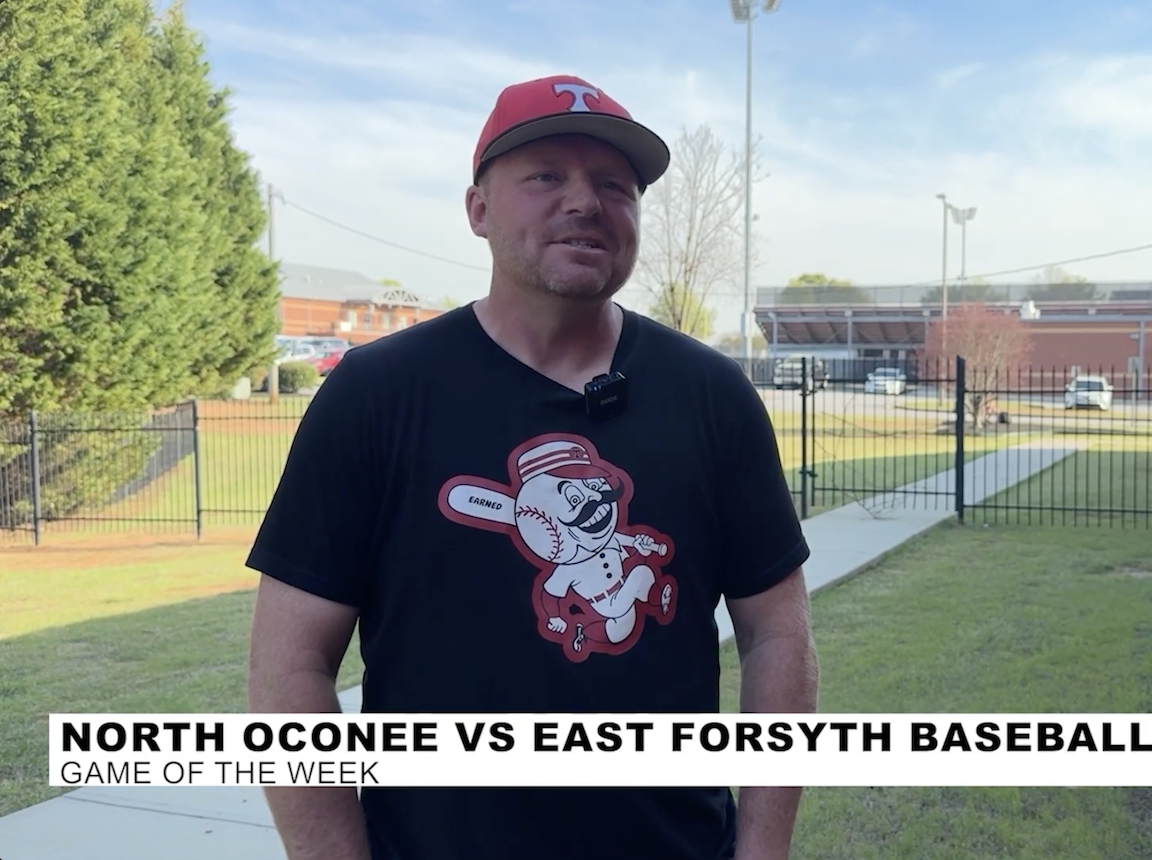 Baseball coach standing near the stadium