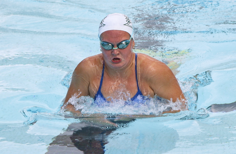 Woman swims in a pool