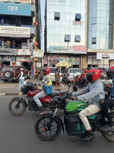 Several motorbikes are lined up on a street