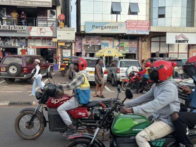 Several motorbikes are lined up on a street