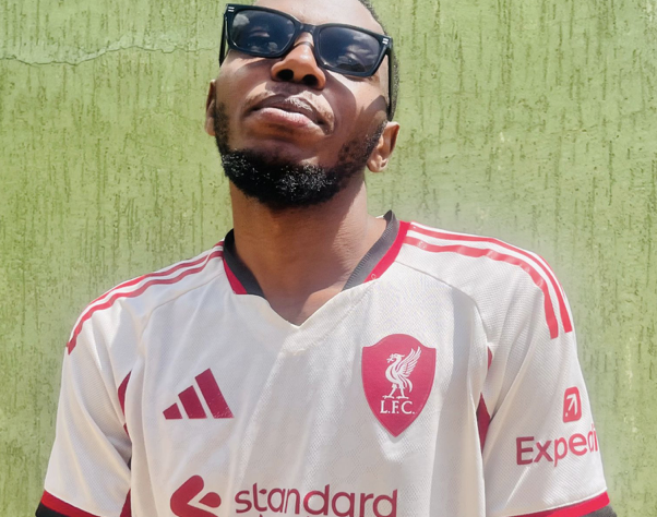 A man in sunglasses smiles